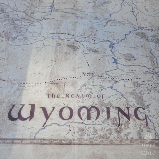 Wyoming wall map done in fantasy art style for home and office decor.
